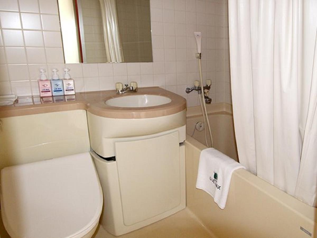 Hotel Livemax Budget Esaka Суйта Экстерьер фото